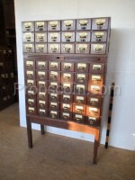 Wooden file cabinet with brass labels