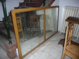 Mirror in a wooden light frame