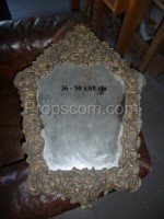 Mirror in a brass decorated frame