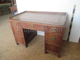 Wooden desk with decorated handles