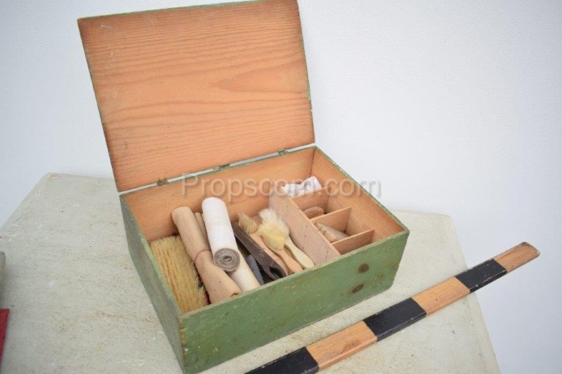 Box with tools for applying wallpaper