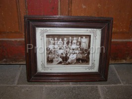 Photo of a family apparently farmhouse in a frame