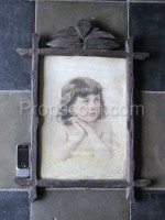 Portrait of a girl carved frame