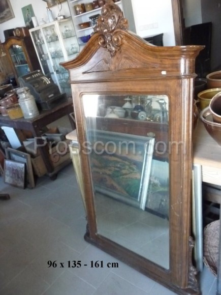 Large mirror in a solid wooden decorated frame