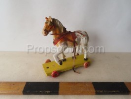 A smaller wooden horse