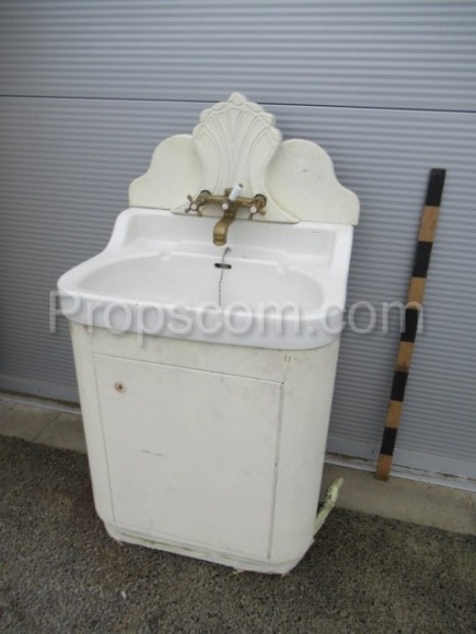 White cabinet with sink decorated