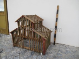 Wooden cage with a roof