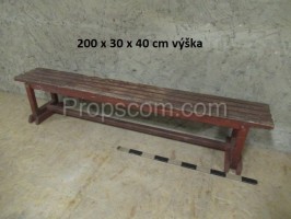 Wooden long brown reinforced bench