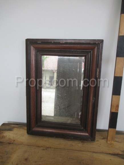 Mirror in a dark wooden frame