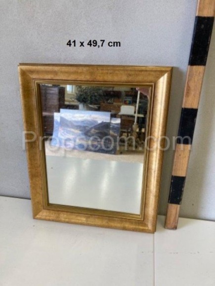 Mirror in a gold frame