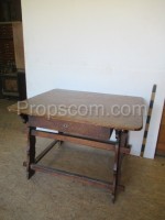 Medieval wooden table with a drawer