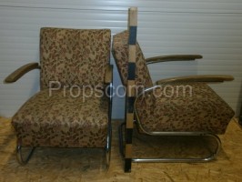 Armchairs upholstered in metal