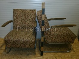 Armchairs upholstered in metal