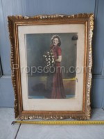 Printed photo of a lady in a red dress in a frame