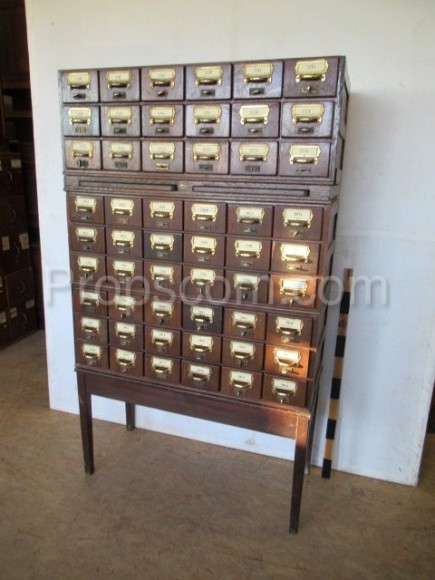 Wooden file cabinet with brass labels