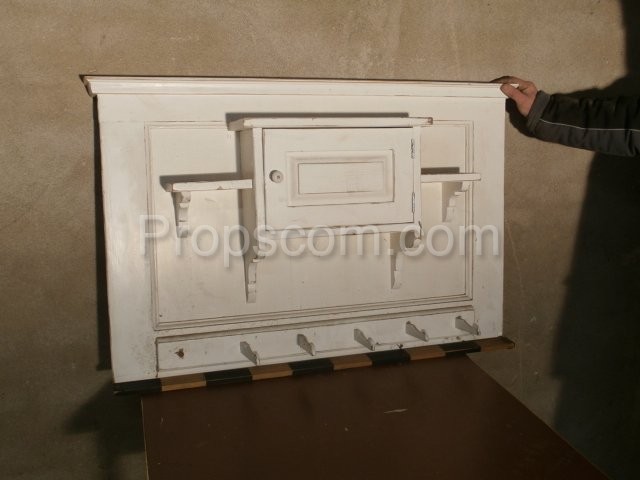 white wooden wall with cabinet, shelves and hangers