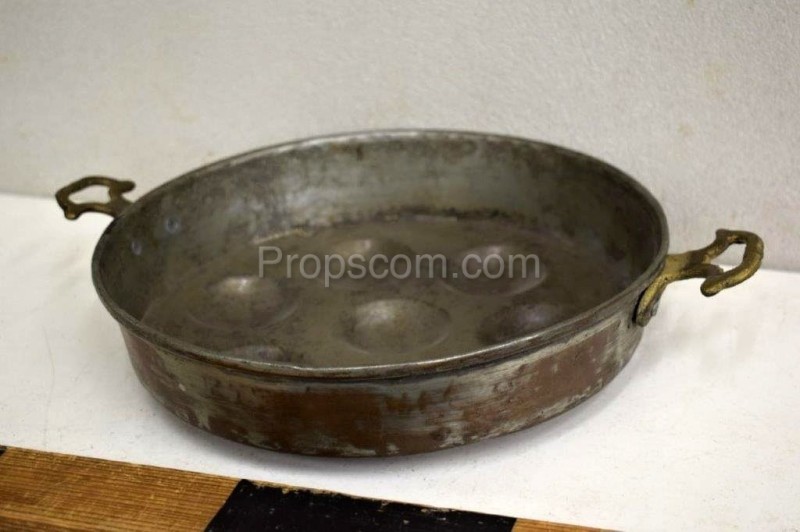 Frying pan with brass handles