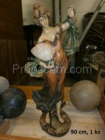 Wooden statue of a lady with a seashell