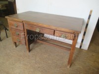 Wooden desk with decorated handles