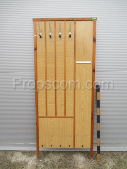 Wooden corridor wall with hangers