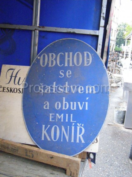 Oval advertising sign: shoe and clothing store