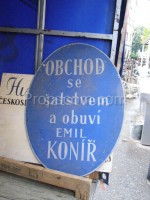 Oval advertising sign: shoe and clothing store