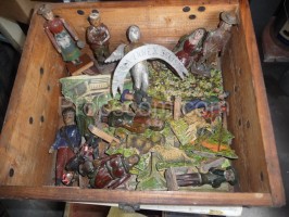 Figurines in a crate