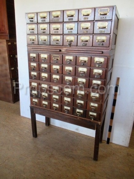 Wooden file cabinet with brass labels