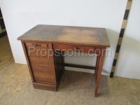 Dark wooden desk with blinds