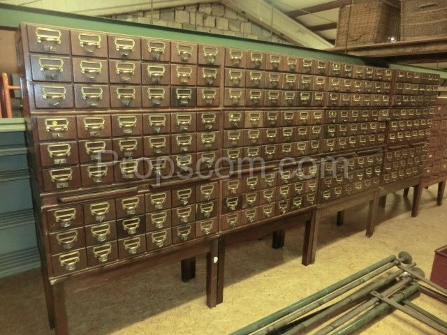 Wooden file cabinet with brass labels