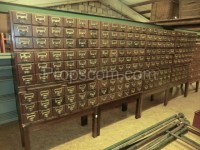 Wooden file cabinet with brass labels