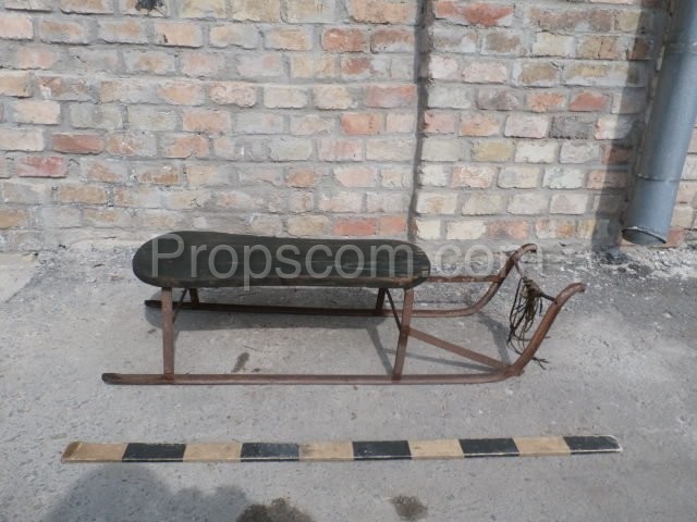 metal sledge with wooden seating