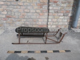 metal sledge with wooden seating