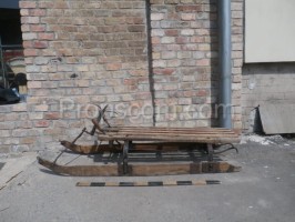 Wooden sled with steering wheel