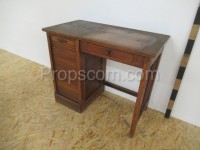 Dark wooden desk with blinds