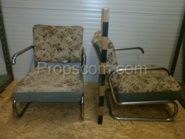 Armchairs upholstered in metal