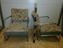 Armchairs upholstered in metal