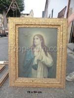 An image of the Virgin Mary in a gold frame