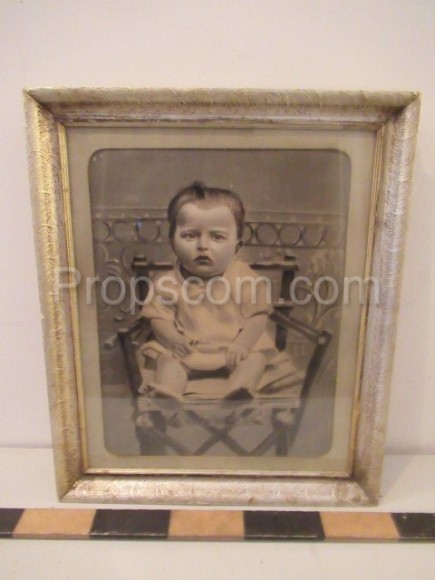 picture baby in a glazed chair