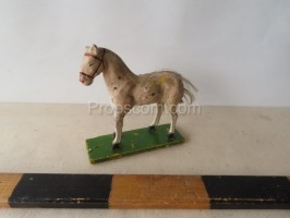 A smaller wooden horse