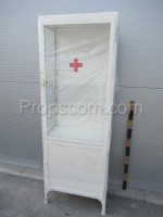 White glazed cabinet with red cross