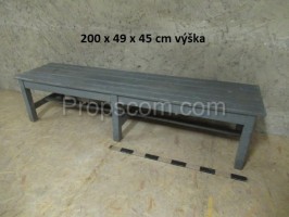 Long gray wooden bench