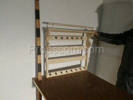 Tall white wooden shelf with hangers