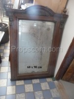 Mirror in a wooden decorated frame