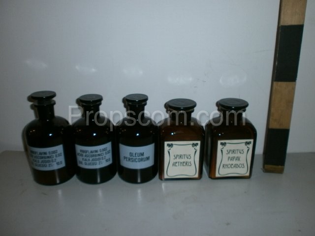 Different bottles, dark glass vials