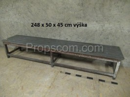 Long gray wooden bench