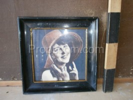 Photo of a woman with a hat glazed in a frame